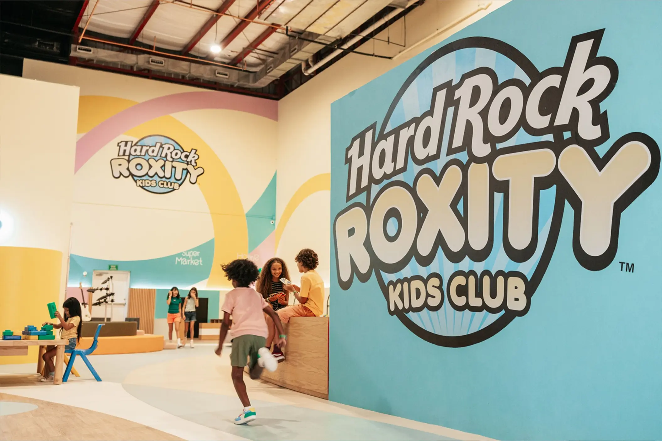 The Hard Rock Roxity Kids Club with children playing and large, colorful signage.
