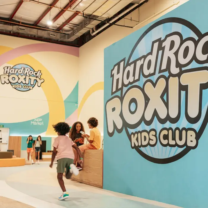 The Hard Rock Roxity Kids Club with children playing and large, colorful signage.