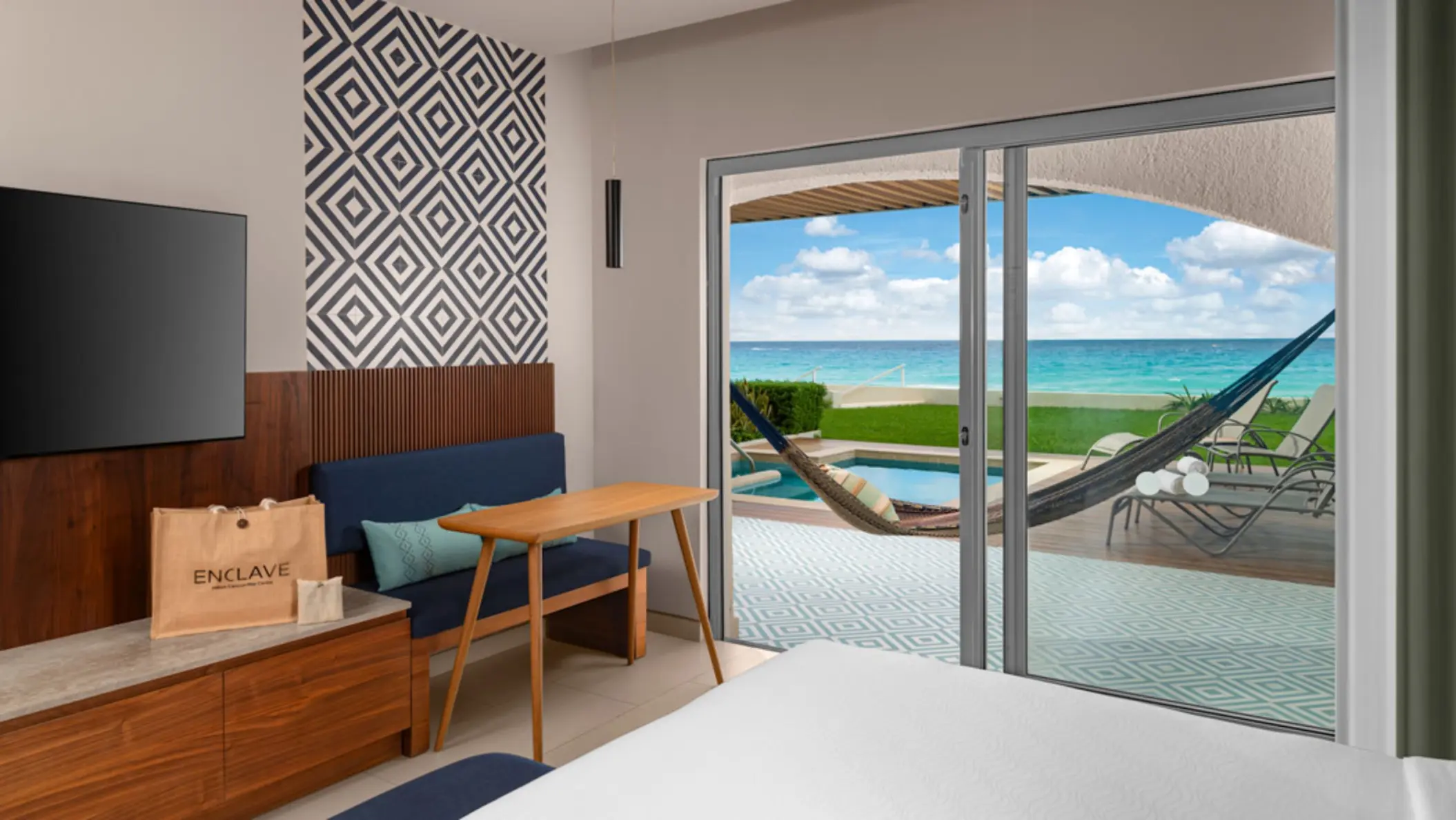 A hotel suite with a private terrace, a small plunge pool, and a hammock with a magnificent ocean view.
