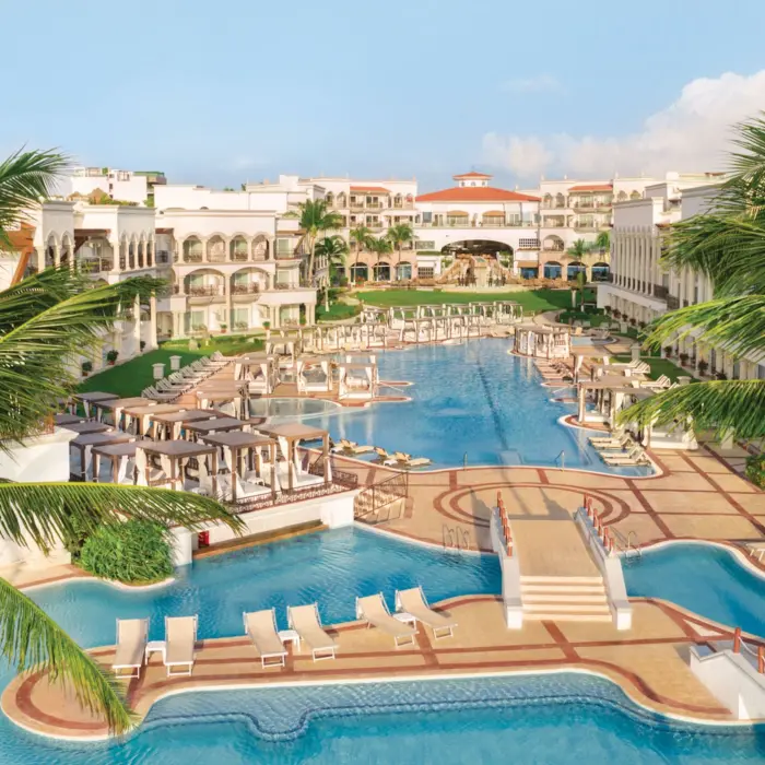 aerial view of the pools and resort buildings at Hilton Playa del Carmen