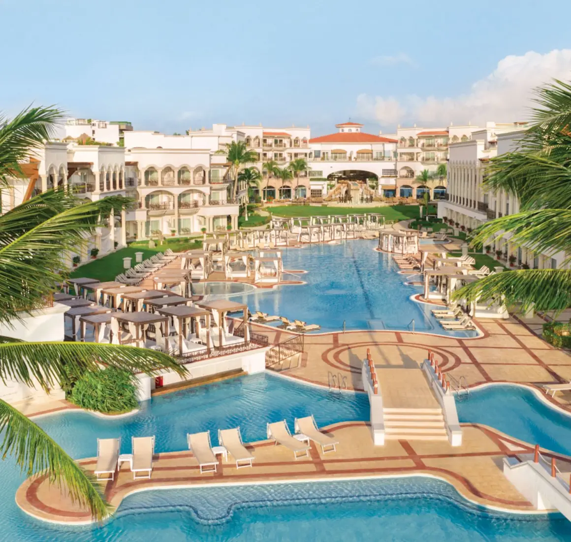 aerial view of the pools and resort buildings at Hilton Playa del Carmen