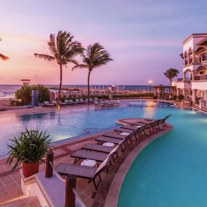 seafront pool during sunset at Hilton Playa del Carmen