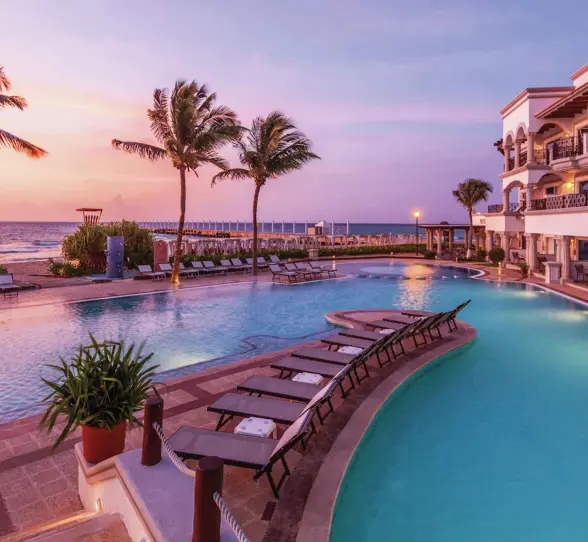 seafront pool during sunset at Hilton Playa del Carmen