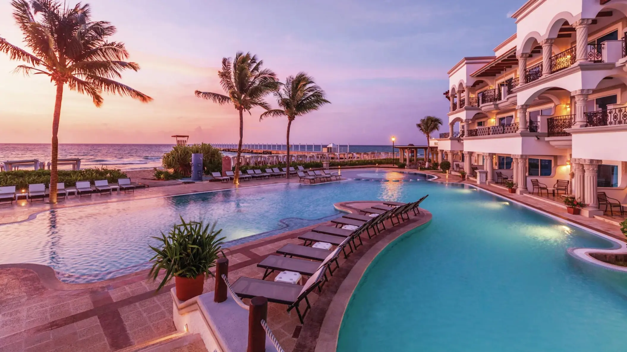 seafront pool during sunset at Hilton Playa del Carmen