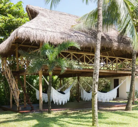 hammocks under a palapa at Hotel Esencia