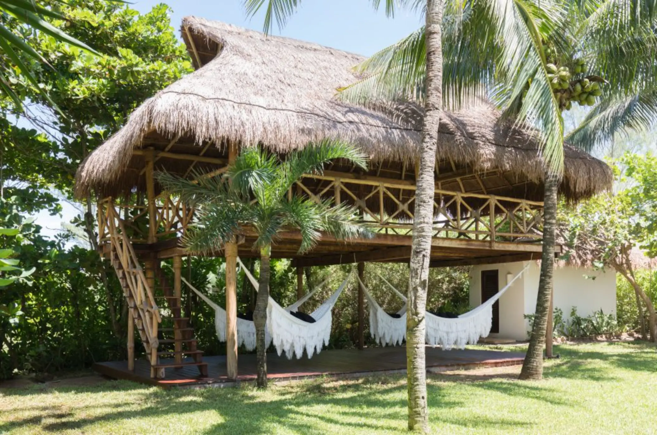 hammocks under a palapa at Hotel Esencia