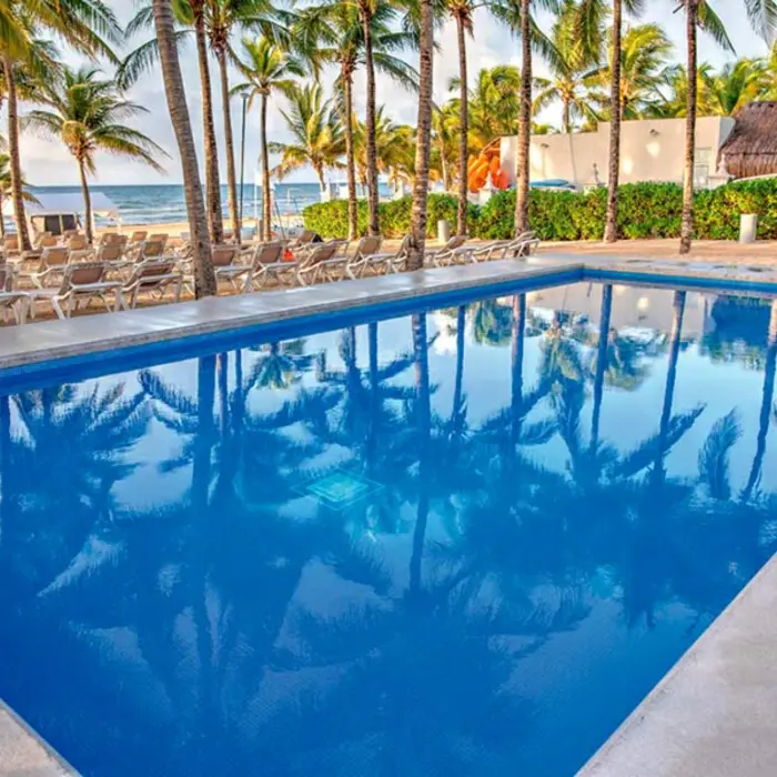 pool on the beach at Hotel Riu Lupita
