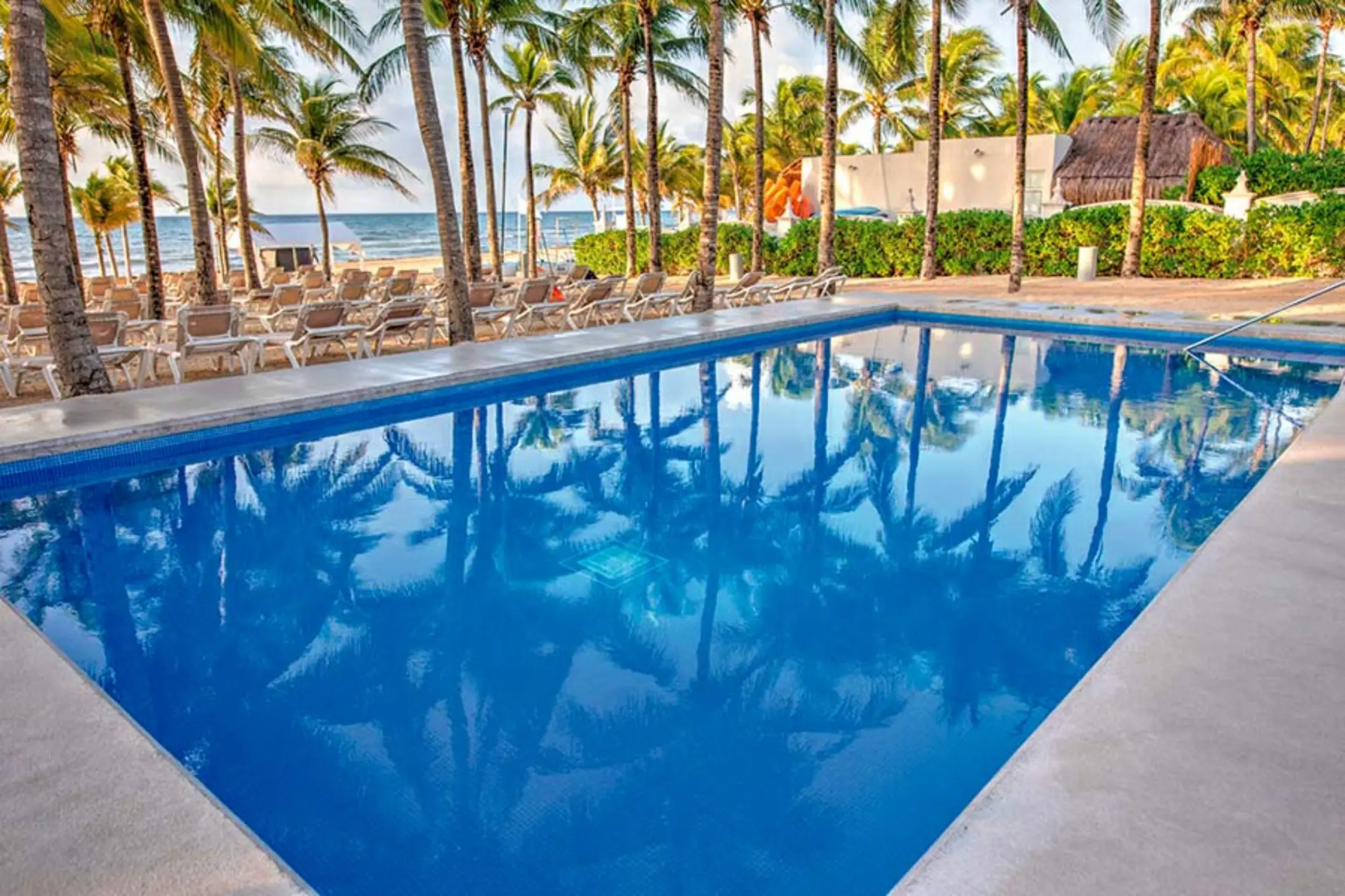 pool on the beach at Hotel Riu Lupita