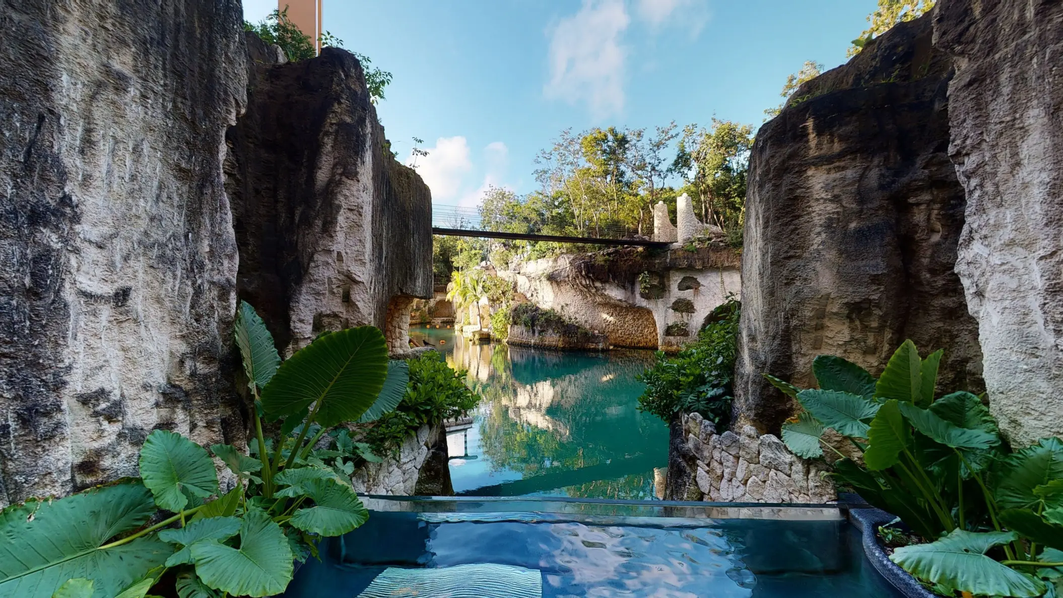Scenic lagoon view framed by natural cliffs and tropical greenery from a private Muluk Spa pool.