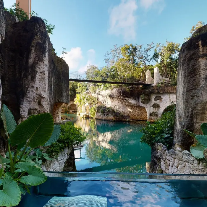 Scenic lagoon view framed by natural cliffs and tropical greenery from a private Muluk Spa pool.
