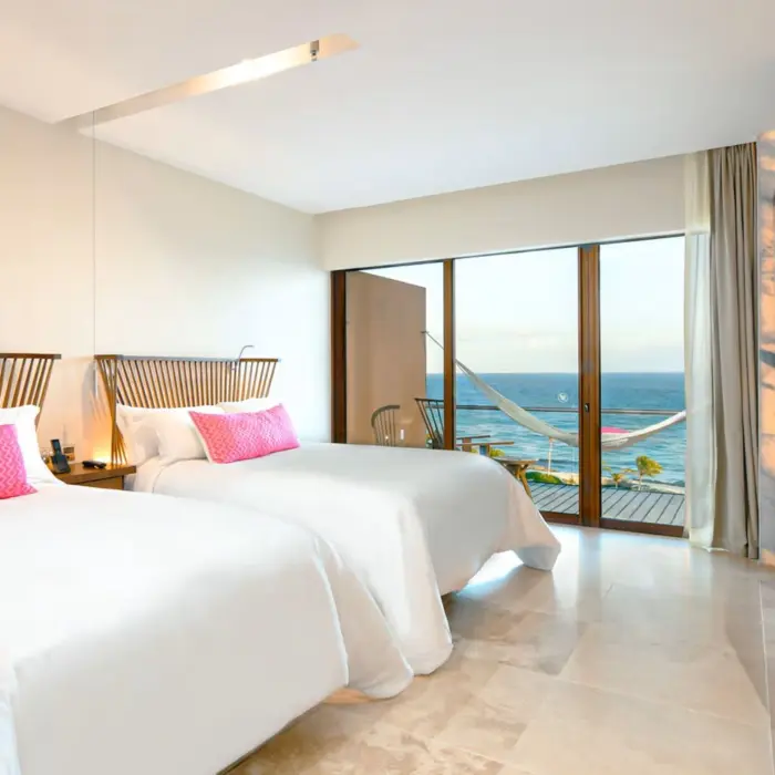 oceanfront suite with two double beds at Hotel Xcaret Mexico