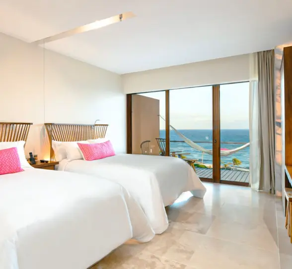oceanfront suite with two double beds at Hotel Xcaret Mexico