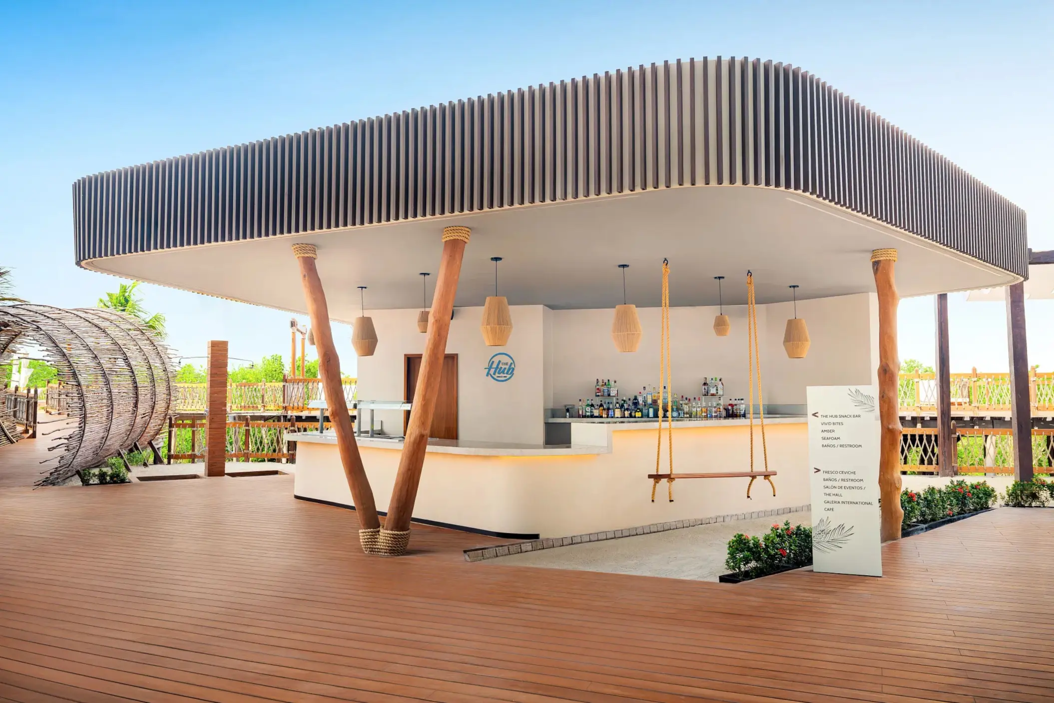 Modern outdoor bar with curved roof, wood accents, swing seating, and bright, airy design elements.