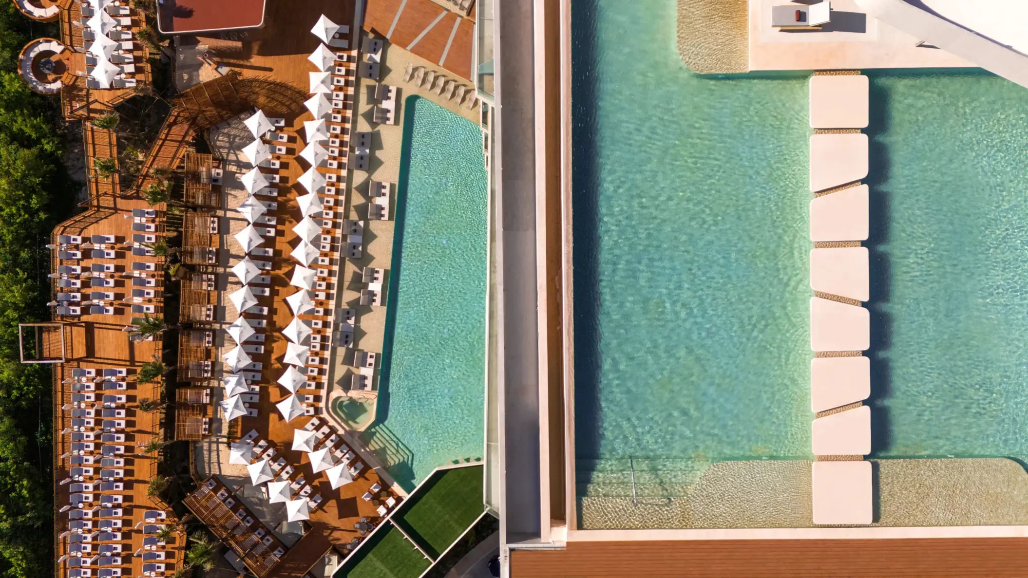 Split aerial view of large pool deck with rows of loungers, umbrellas, and modern geometric stepping stones.