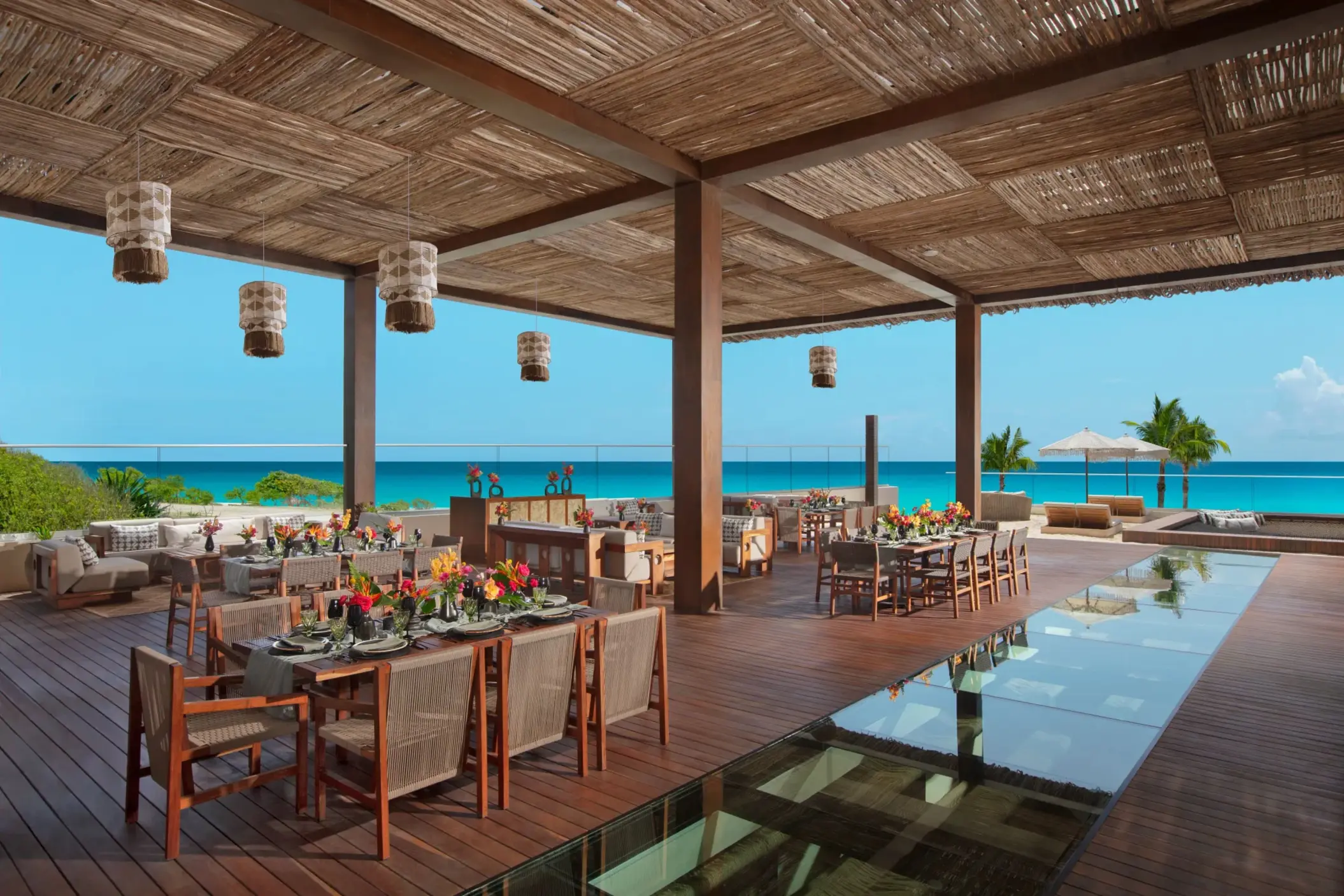 Indoor gala dinner at Ennea Restaurant with long banquet tables, chic décor, and ambient lighting.
