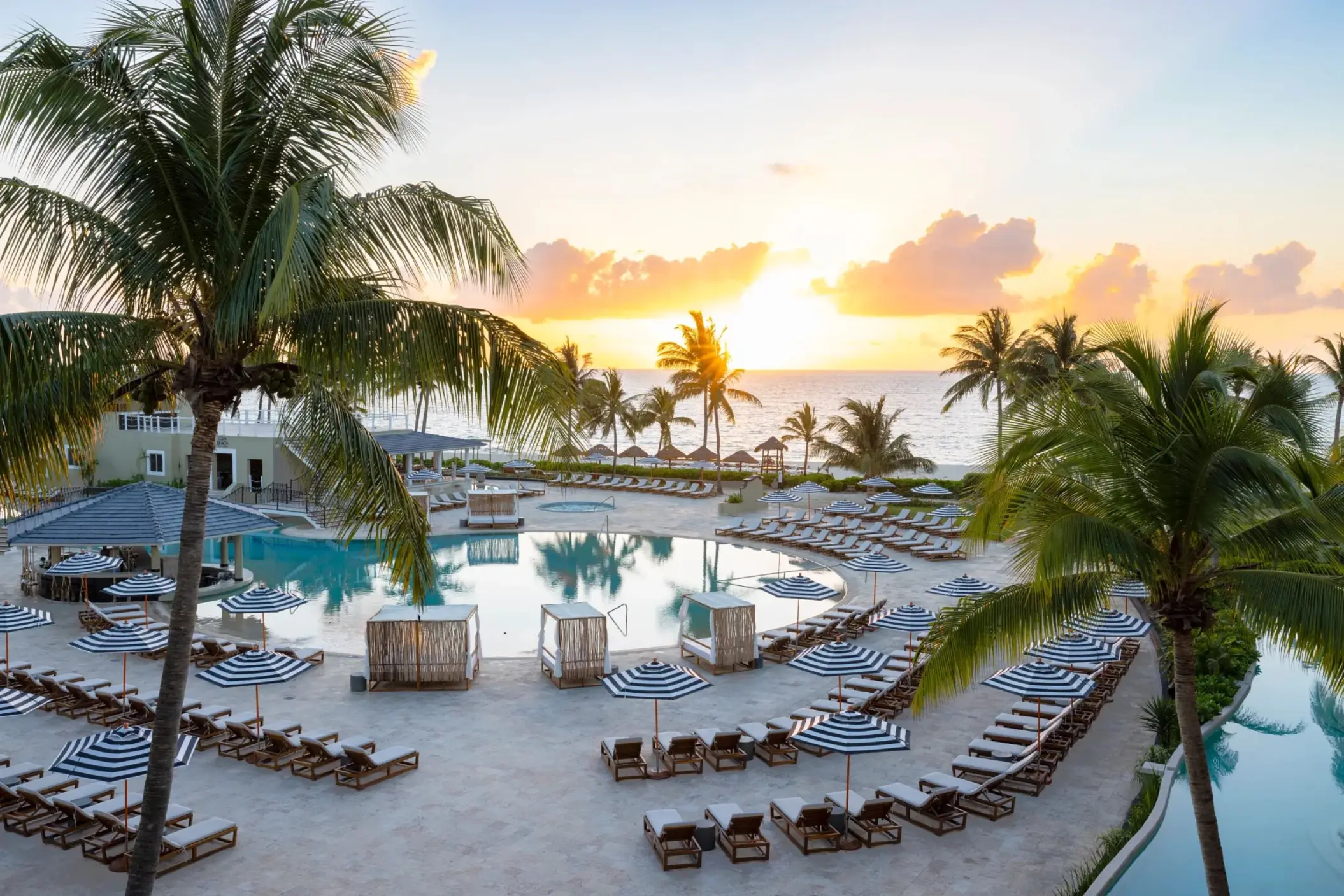 pool with loungers and the beach and ocean at Hyatt Zilara Riviera Maya