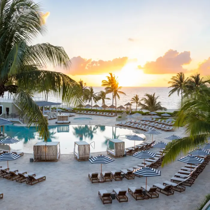 pool with loungers and the beach and ocean at Hyatt Zilara Riviera Maya
