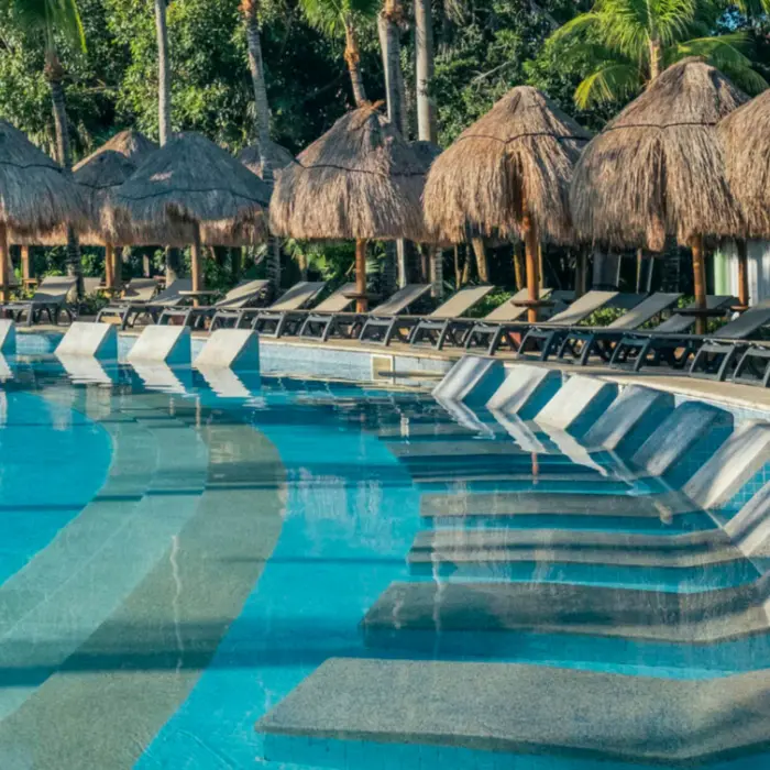 pool and poolside loungers at Iberostar Waves Paraiso del Mar