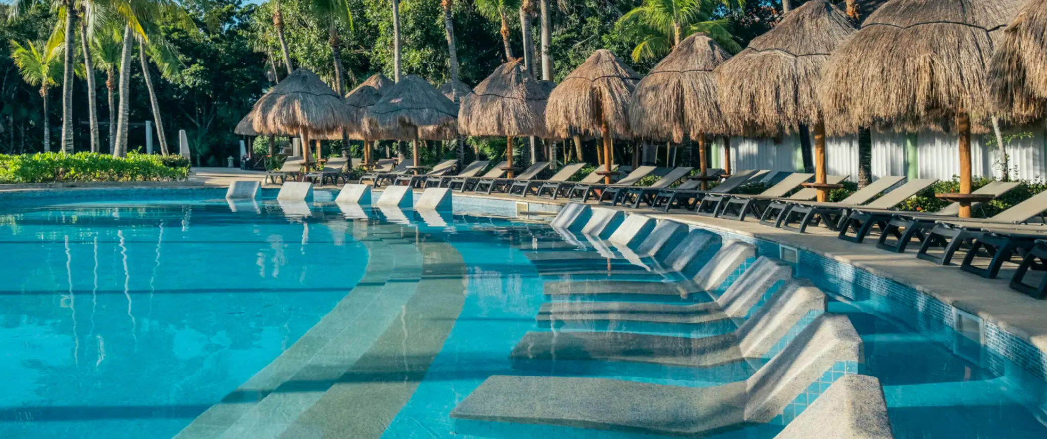 pool and poolside loungers at Iberostar Waves Paraiso del Mar