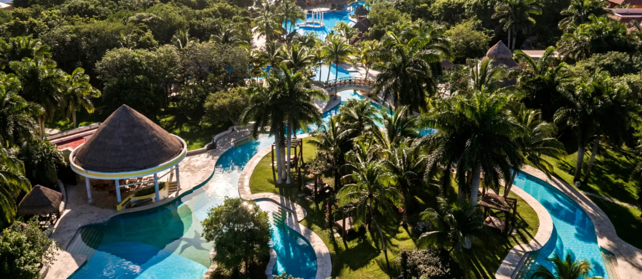 aerial view of the pools and tropical gardens at Iberostar Waves Paraiso del Mar