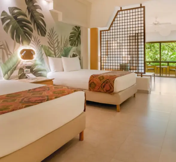 suite with two double beds at Iberostar Selection Paraiso Maya Suites