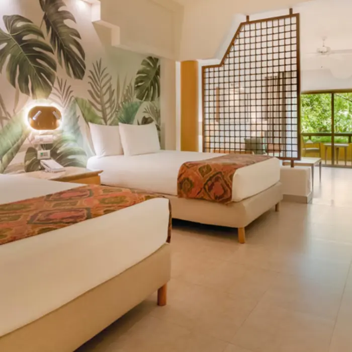 suite with two double beds at Iberostar Selection Paraiso Maya Suites