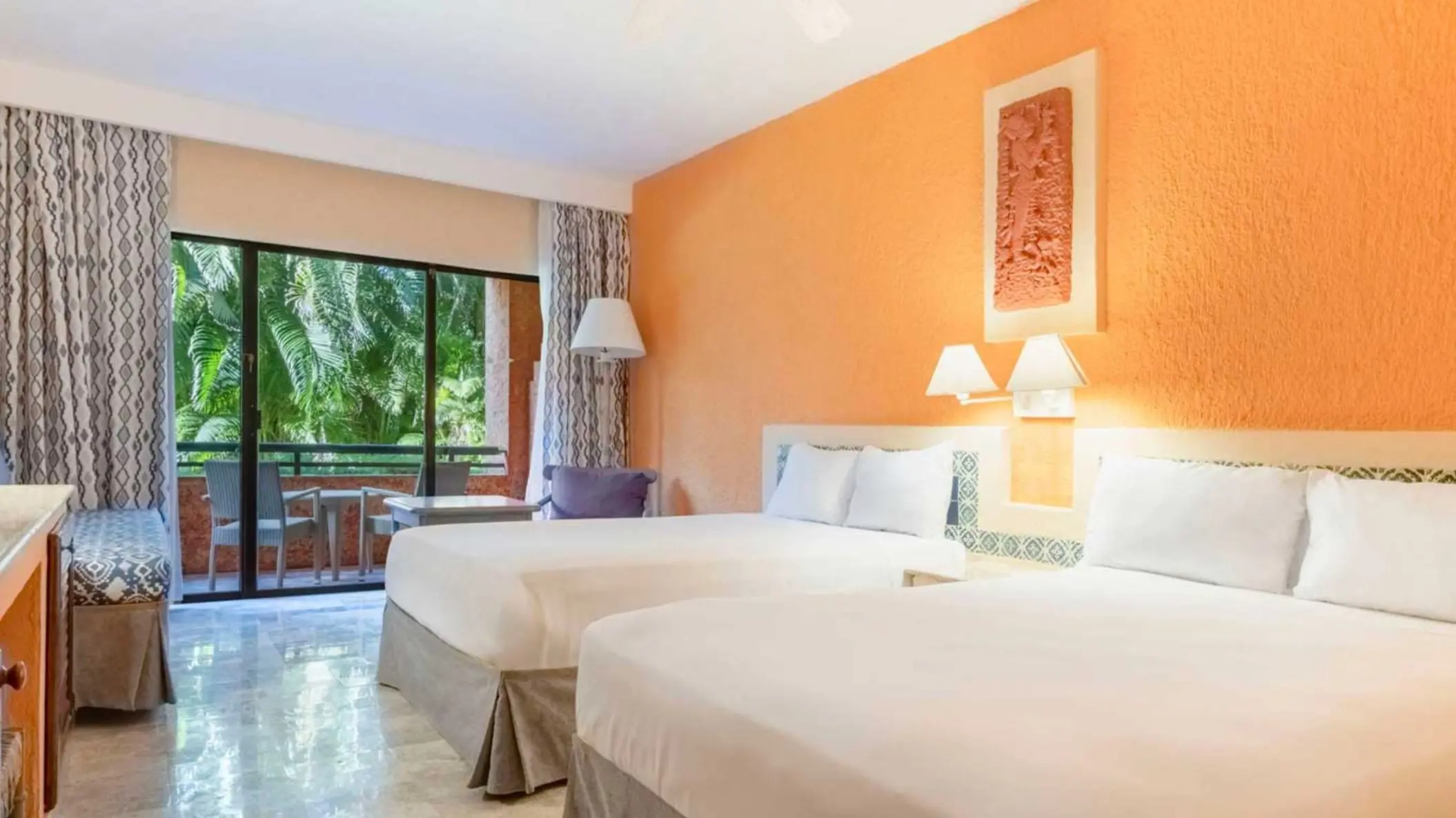 suite with two beds at Iberostar Waves Tucan