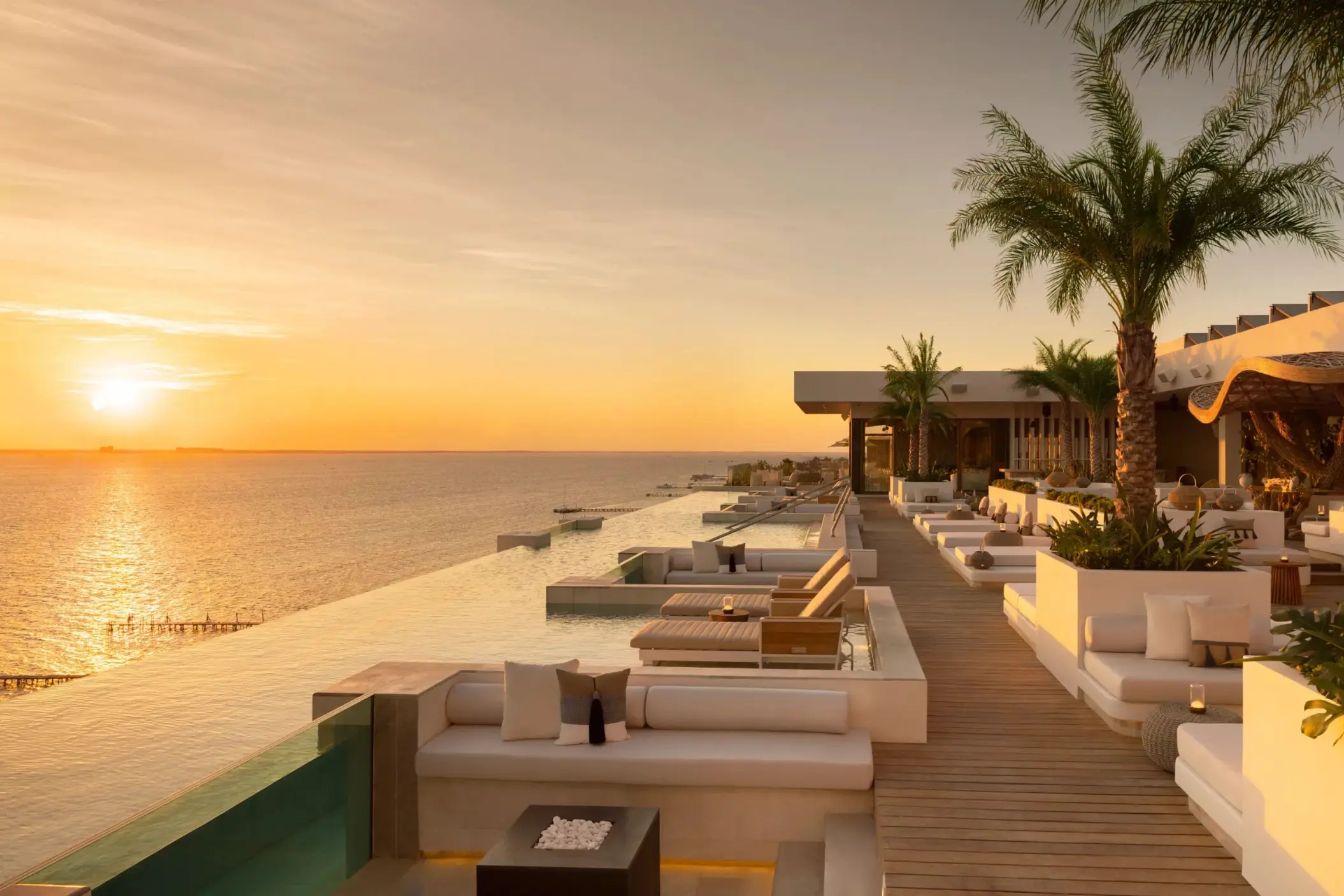 sunset over the pool at Impression Isla Mujeres by Secrets