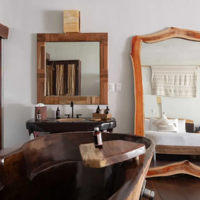 jungle suite king bed at Kanan Tulum Hotel & Spa
