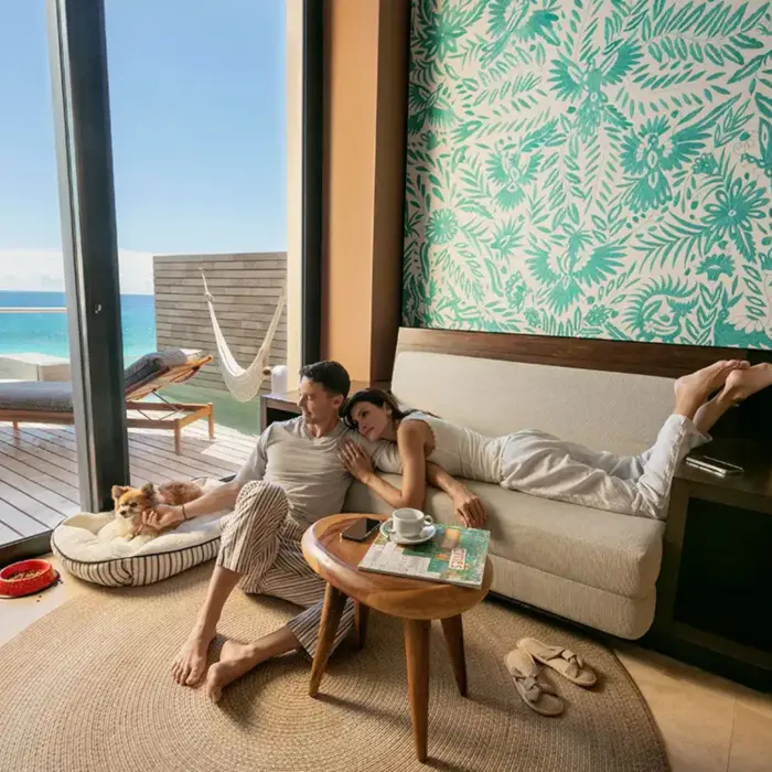 couple lounging in their suite at La Casa de la Playa