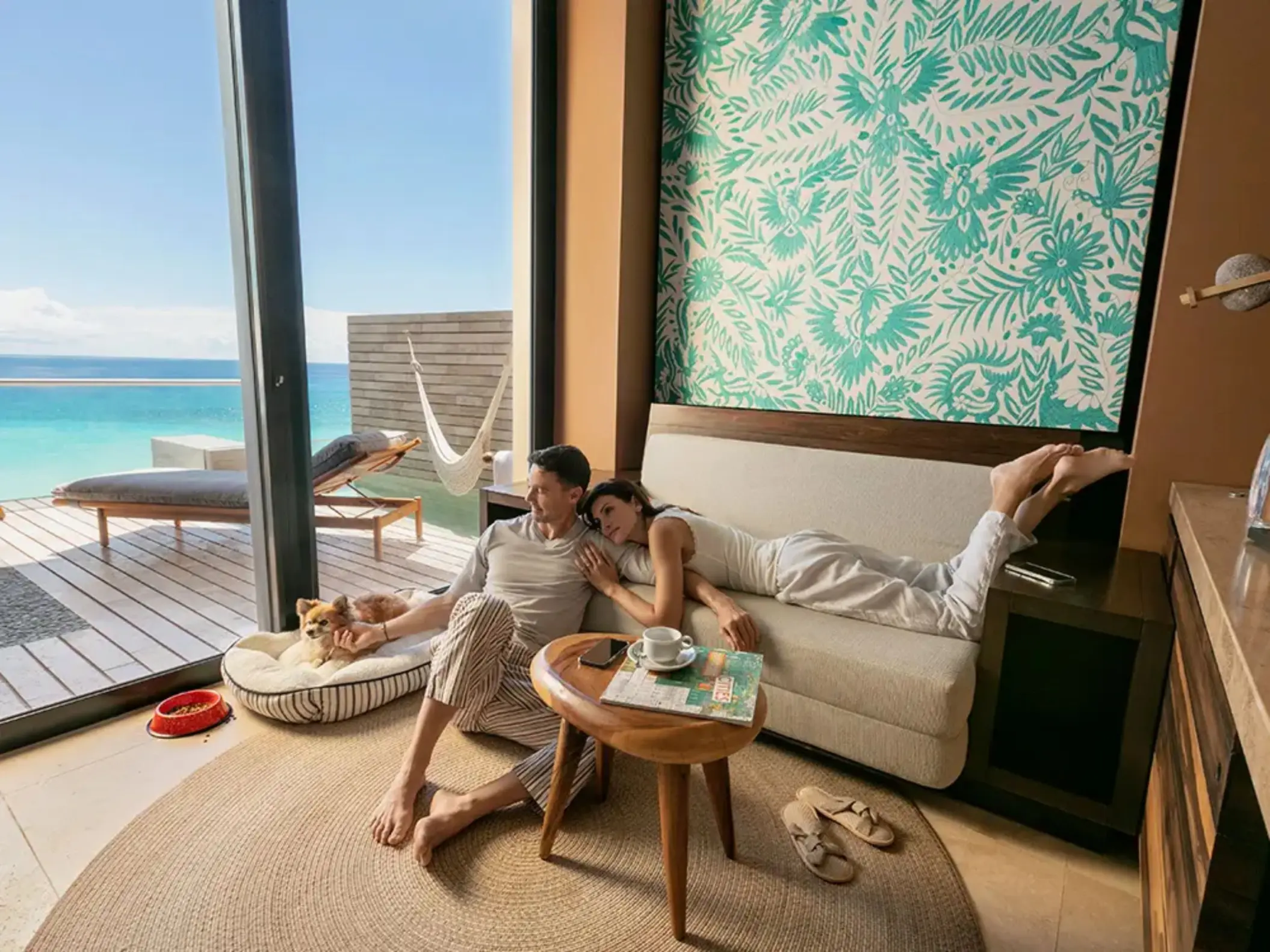 couple lounging in their suite at La Casa de la Playa