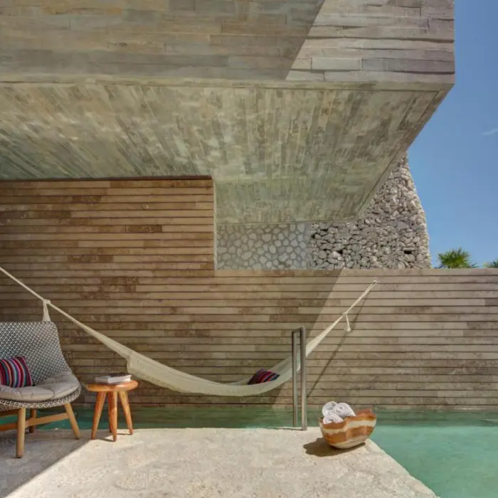 balcony of a suite with plunge pool, hammock, and seating at La Casa de la Playa
