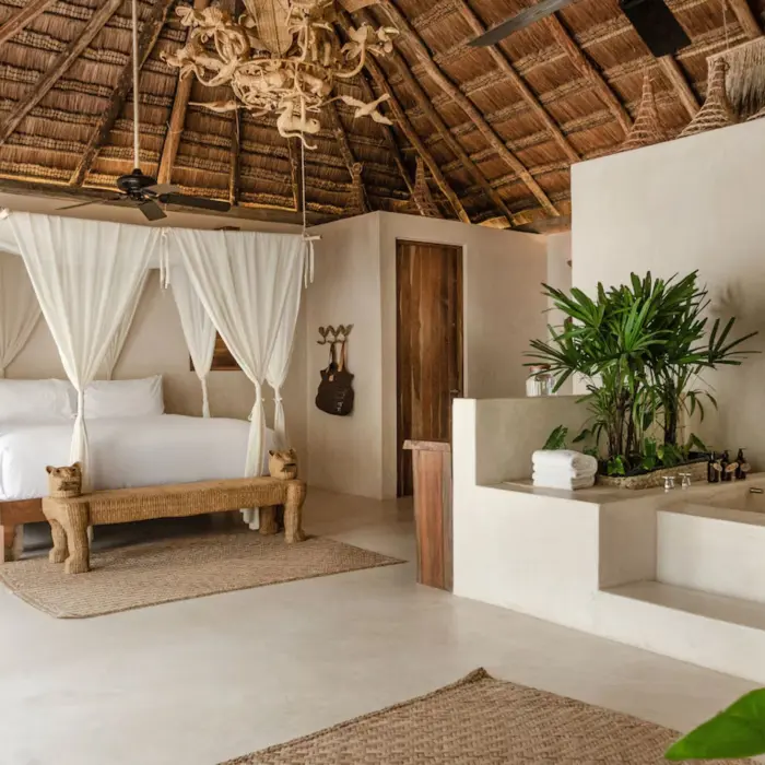 room at La Valise Tulum with poster bed and bathtub