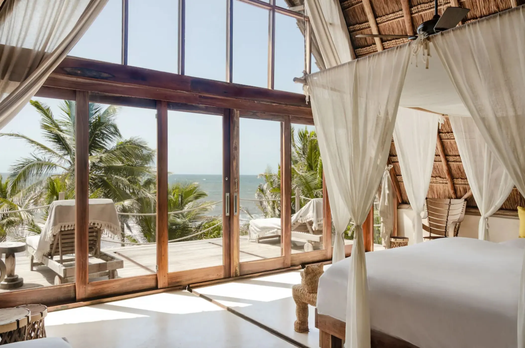 rustic room at La Valise Tulum with wooden accents and ocean views