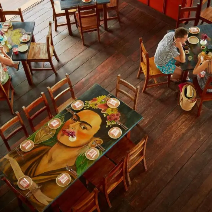 restaurant with vibrant art at La Zebra Tulum