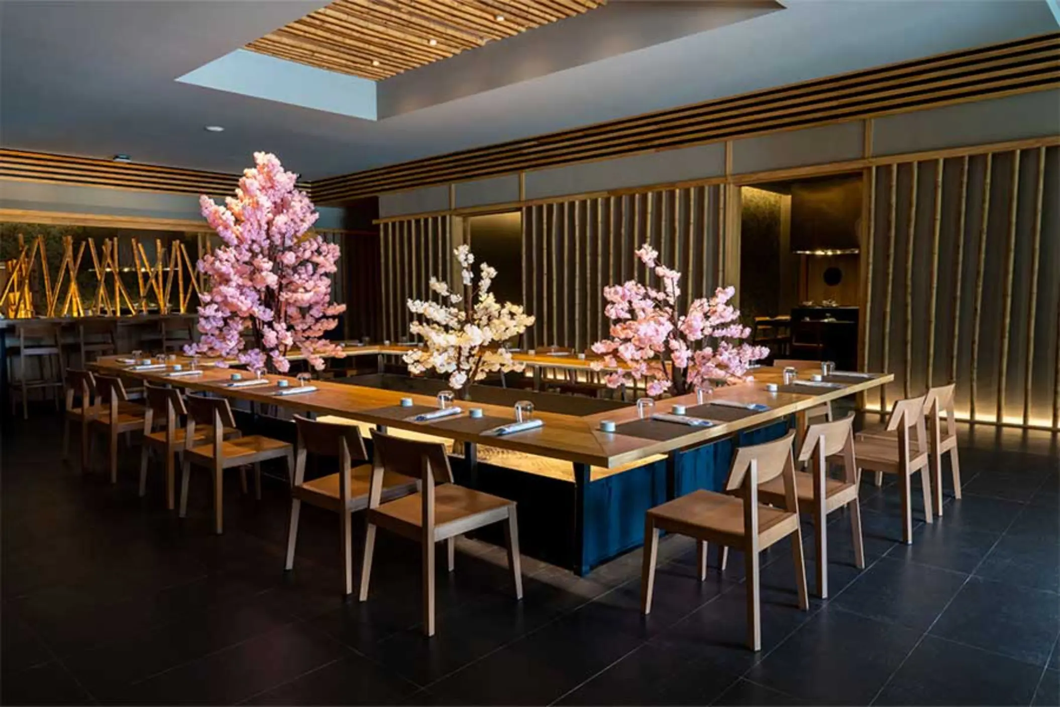 Elegant dining space with cherry blossom decor, wooden furniture, and a zen-inspired ambiance.