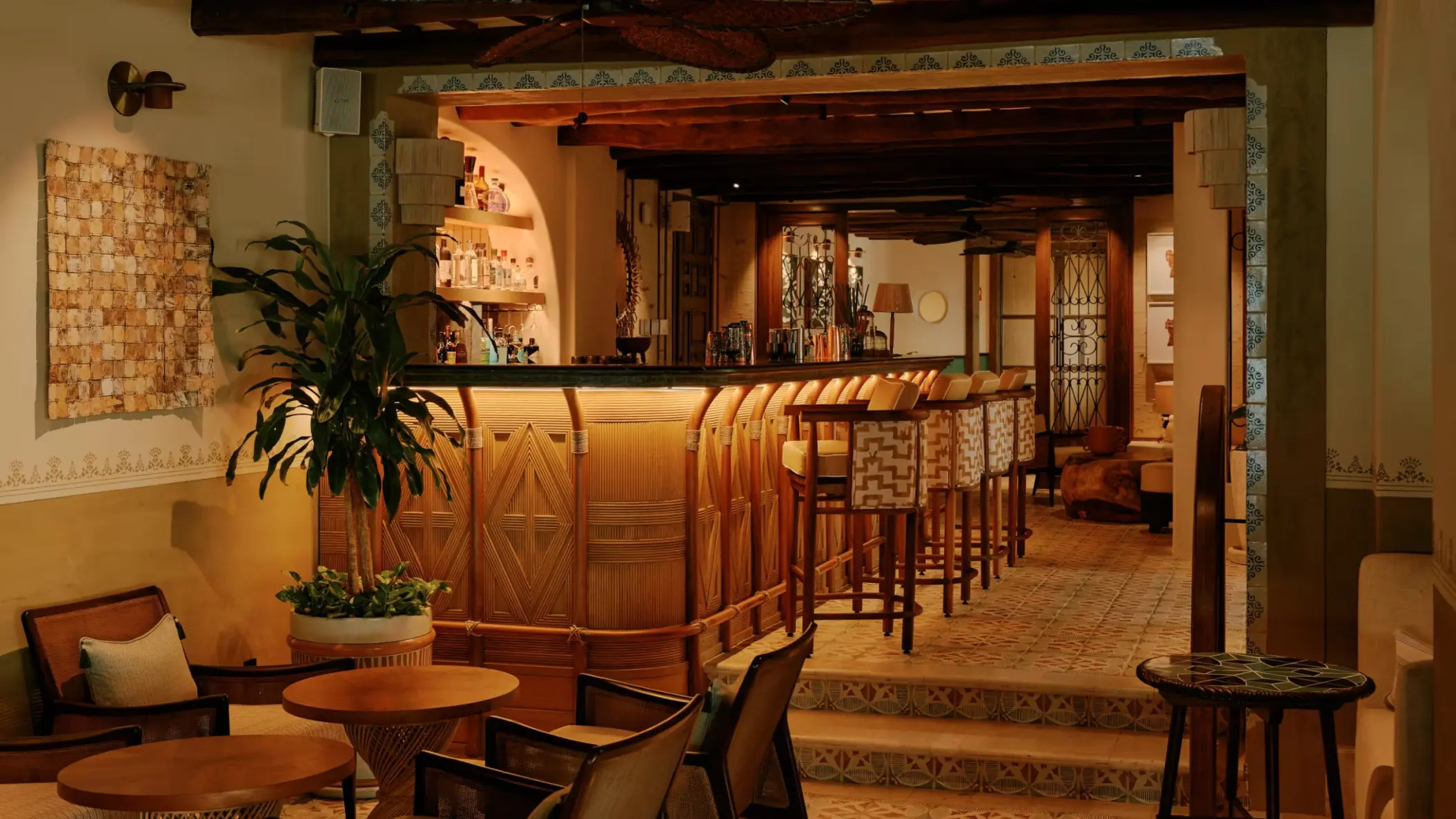 cozy Bambuco restaurant bar at Maroma Belmond featuring wooden tables and chairs