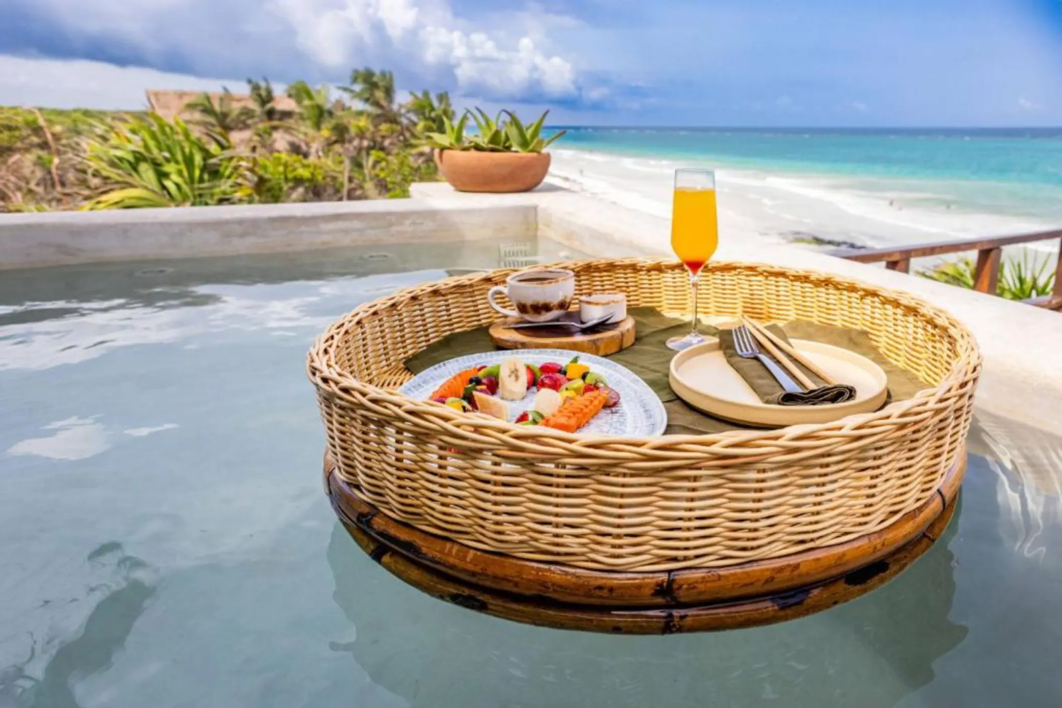 floating breakfast at the oceanfront pool at Mezzanine Hotel