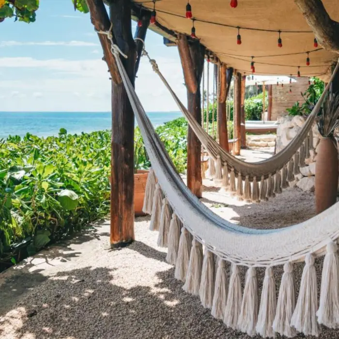 hammocks by the beach at Mezzanine Hotel