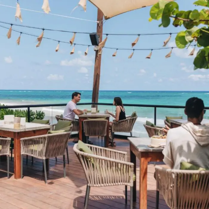 people at the seafront restaurant at Mezzanine Hotel