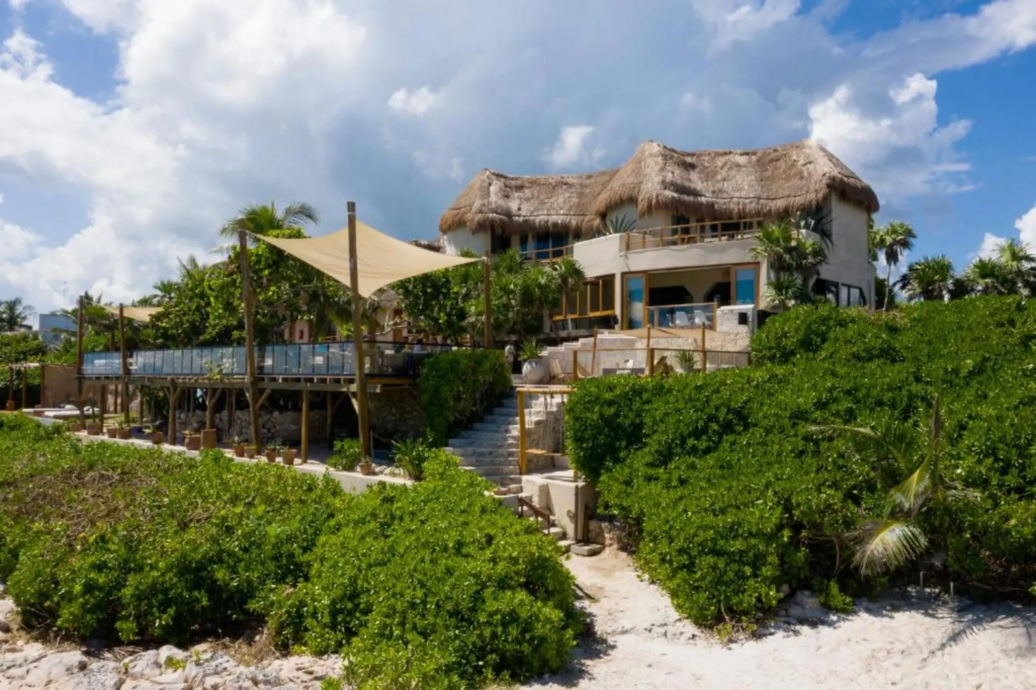 steps leading from the hotel to the beach at Mezzanine Hotel