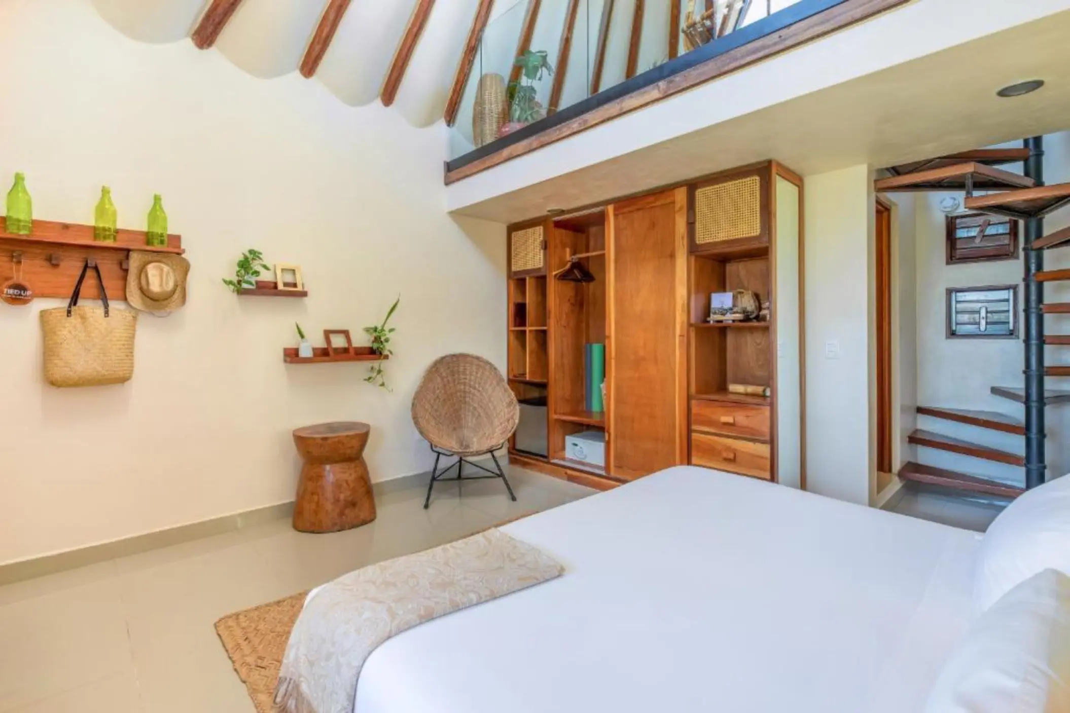 suite with wooden accents at Mezzanine Hotel