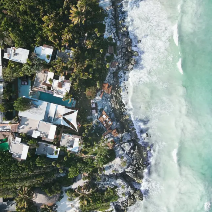 aerial view of Mi Amor hotel with its beach and palms