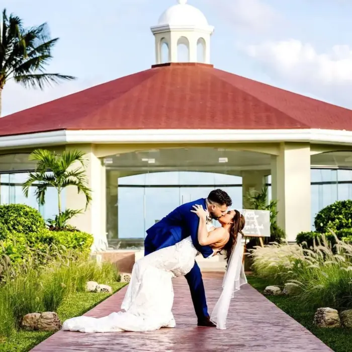 bride and groom kiss at Moon Palace Cancun