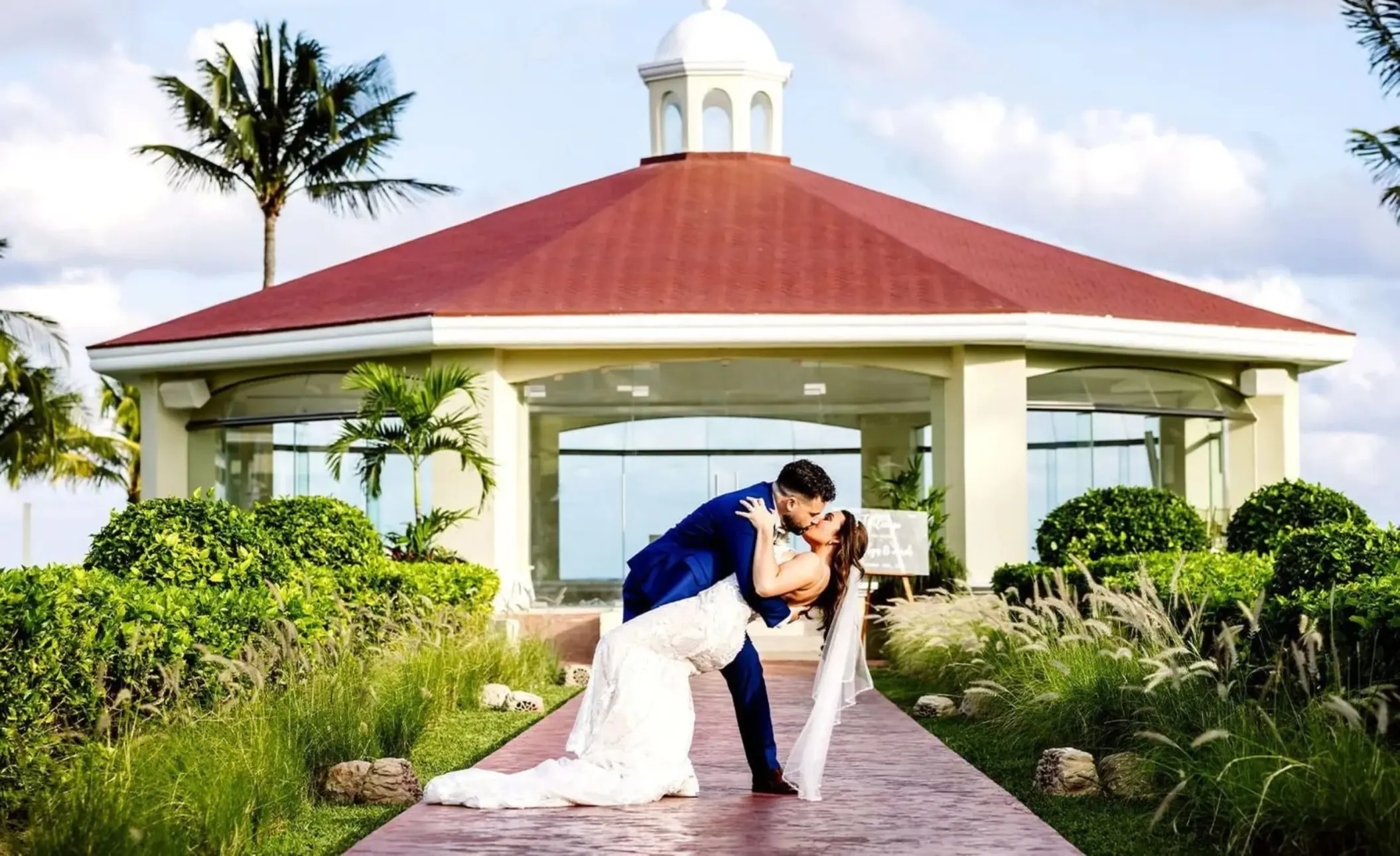 bride and groom kiss at Moon Palace Cancun