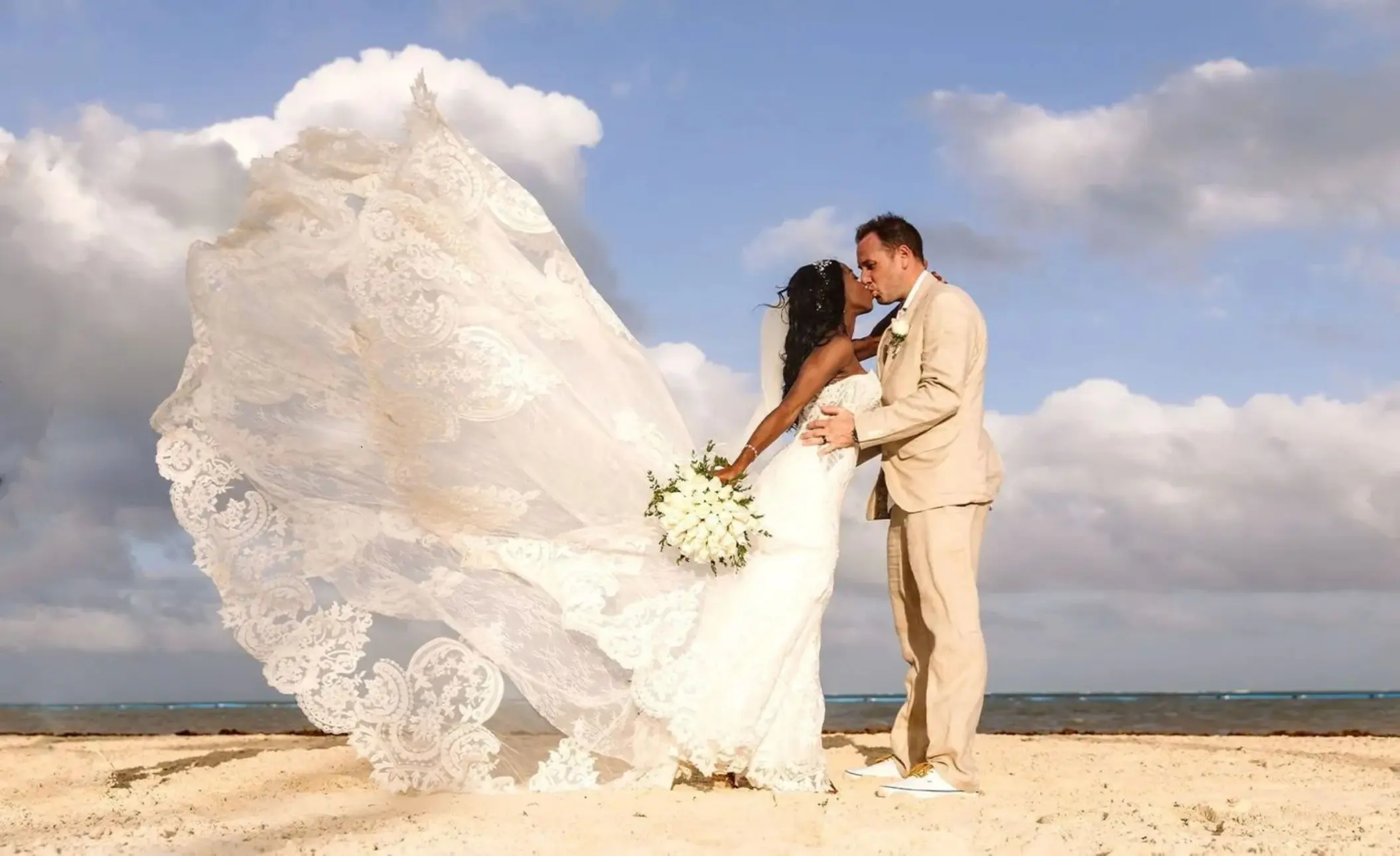 bride and groom on the beach at Moon Palace Cancun