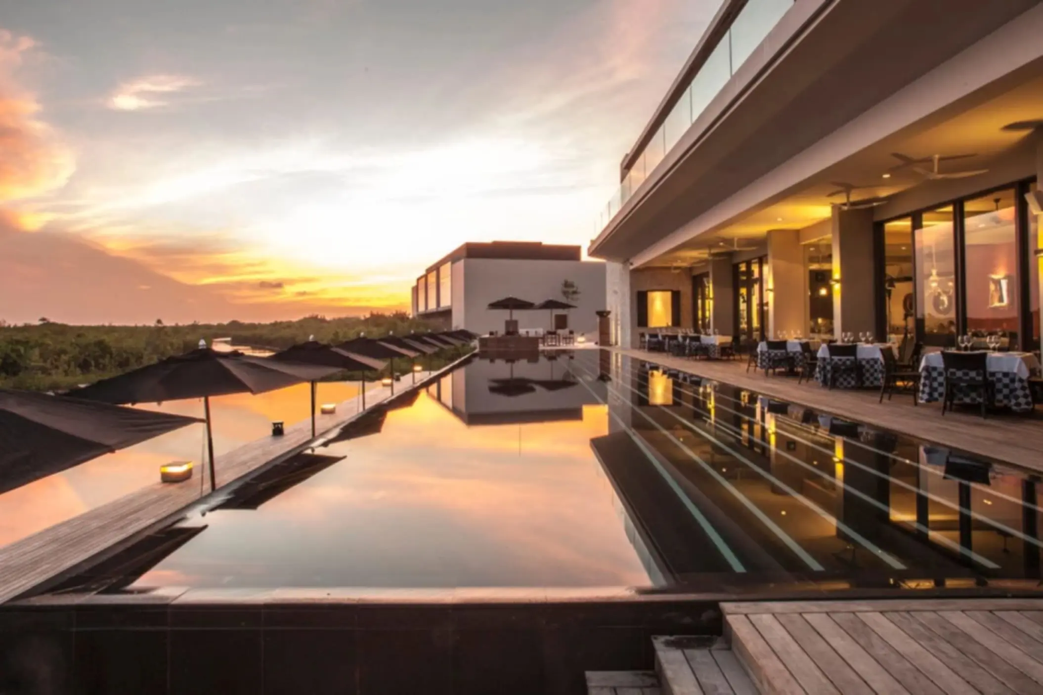 sunset over the pool at Nizuc Resort and Spa