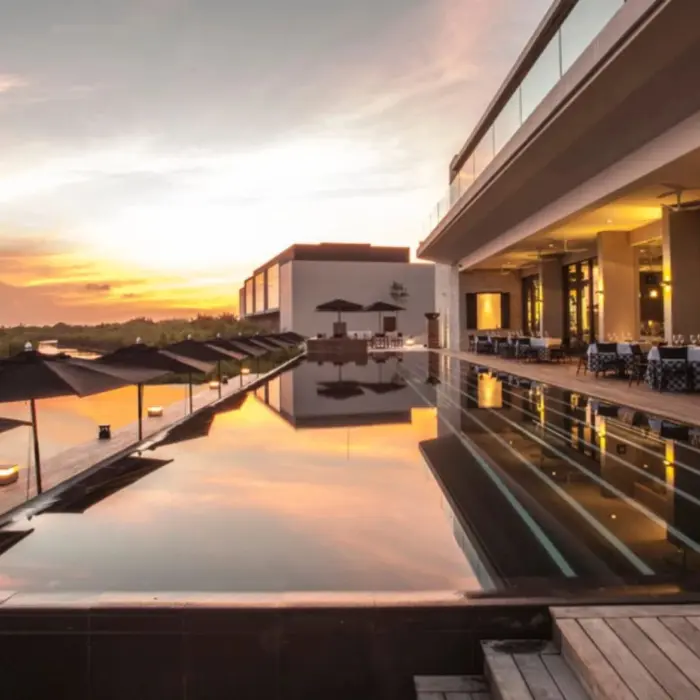 sunset over the pool at Nizuc Resort and Spa
