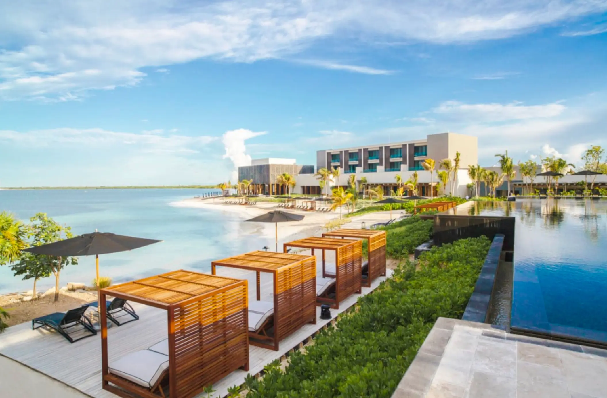 pool, cabanas, and the beach at Nizuc Resort and Spa