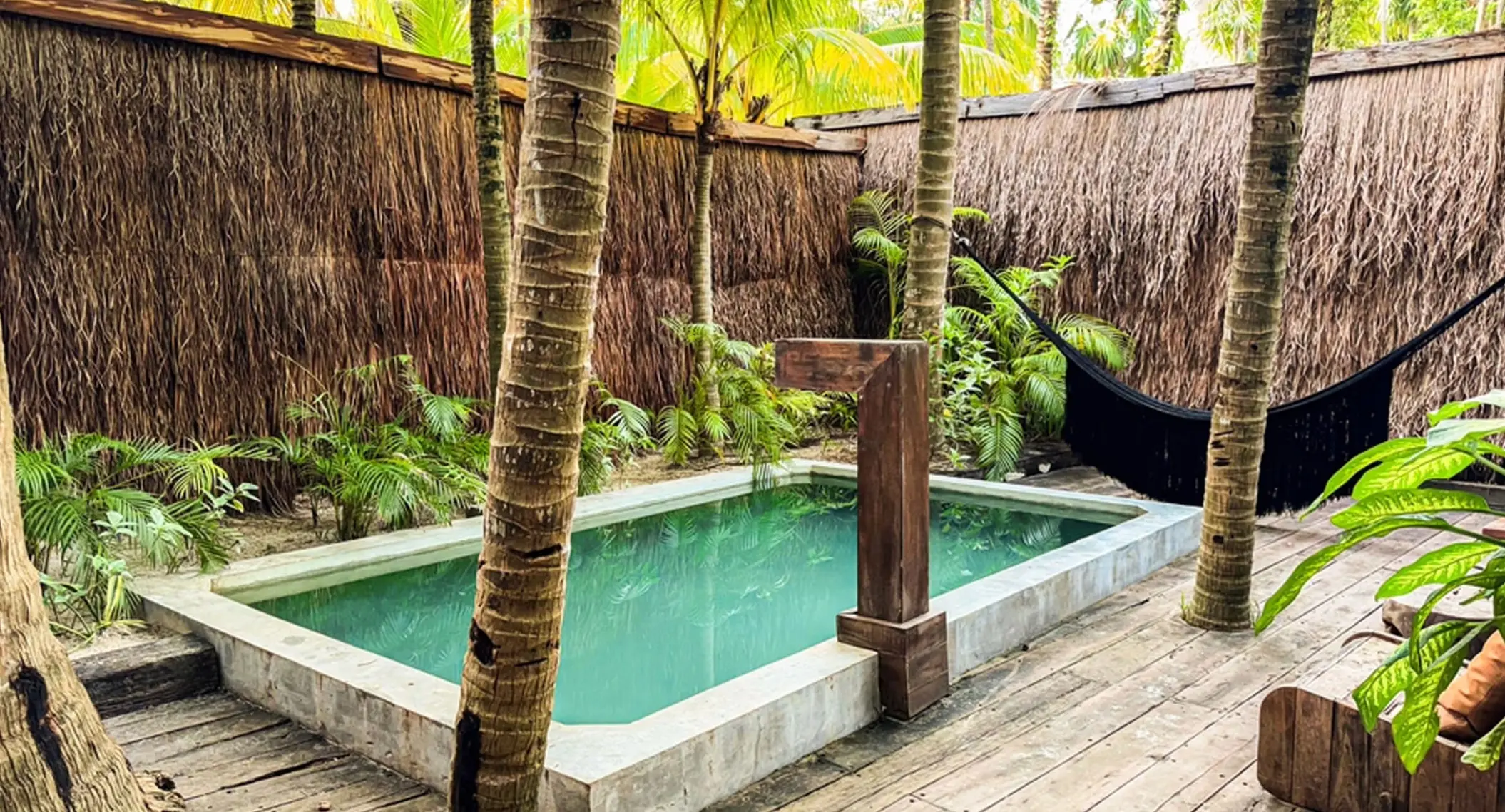a suite's private pool and hammock at nomade tulum